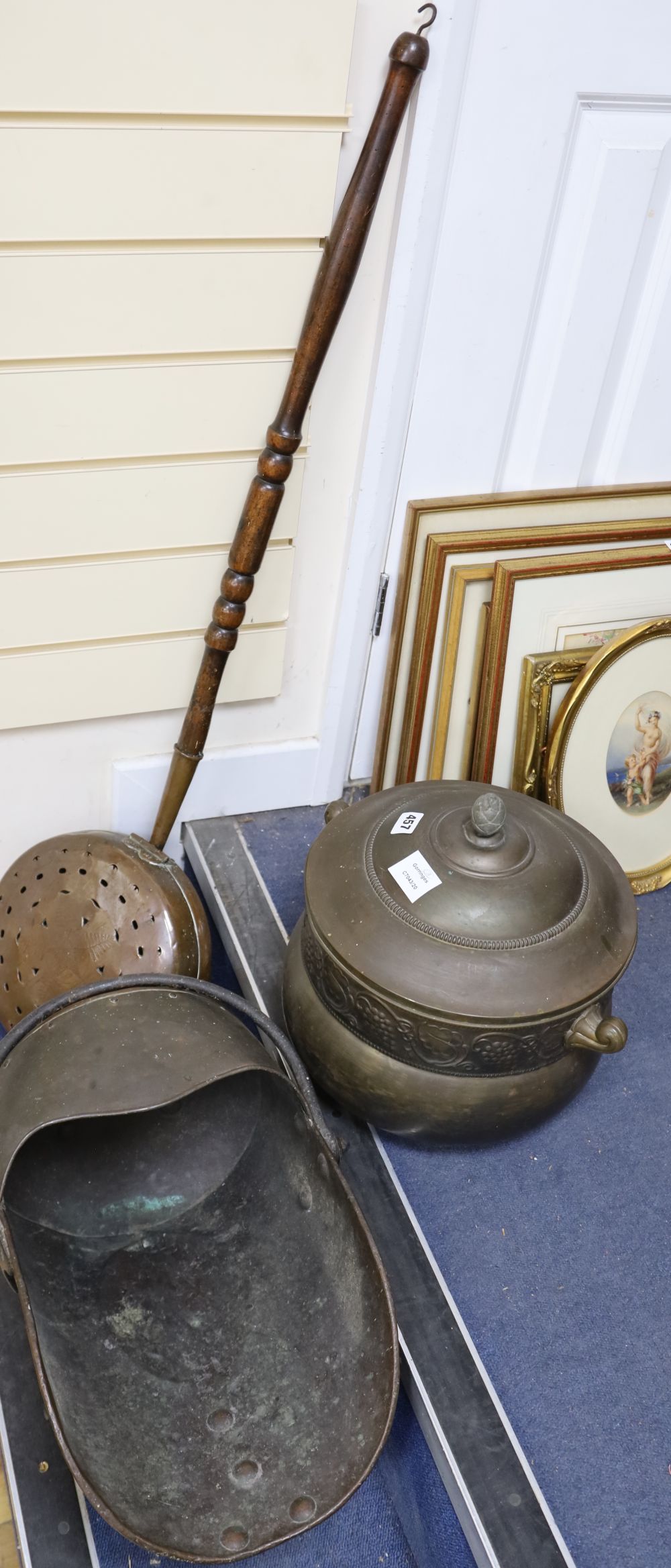 A Danish oxidised tin punch bowl, a Victorian copper coal helmet and a Victorian copper warming pan (3)